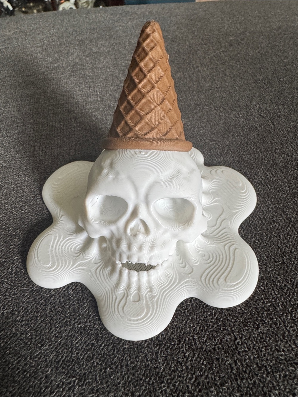 Summerween White Melting Skull Sculpture with Brown Ice Cream Cone